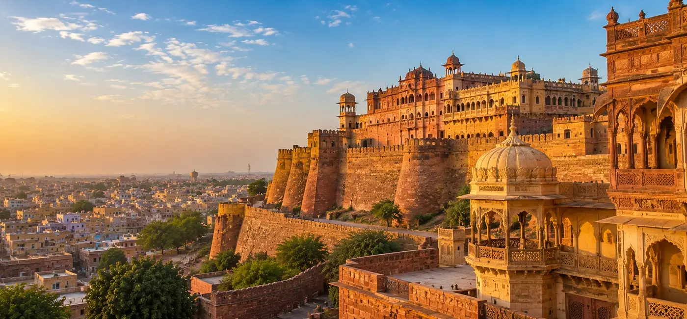 Hawa Mahal and historic Jaipur cityscape at sunset in Rajasthan, India